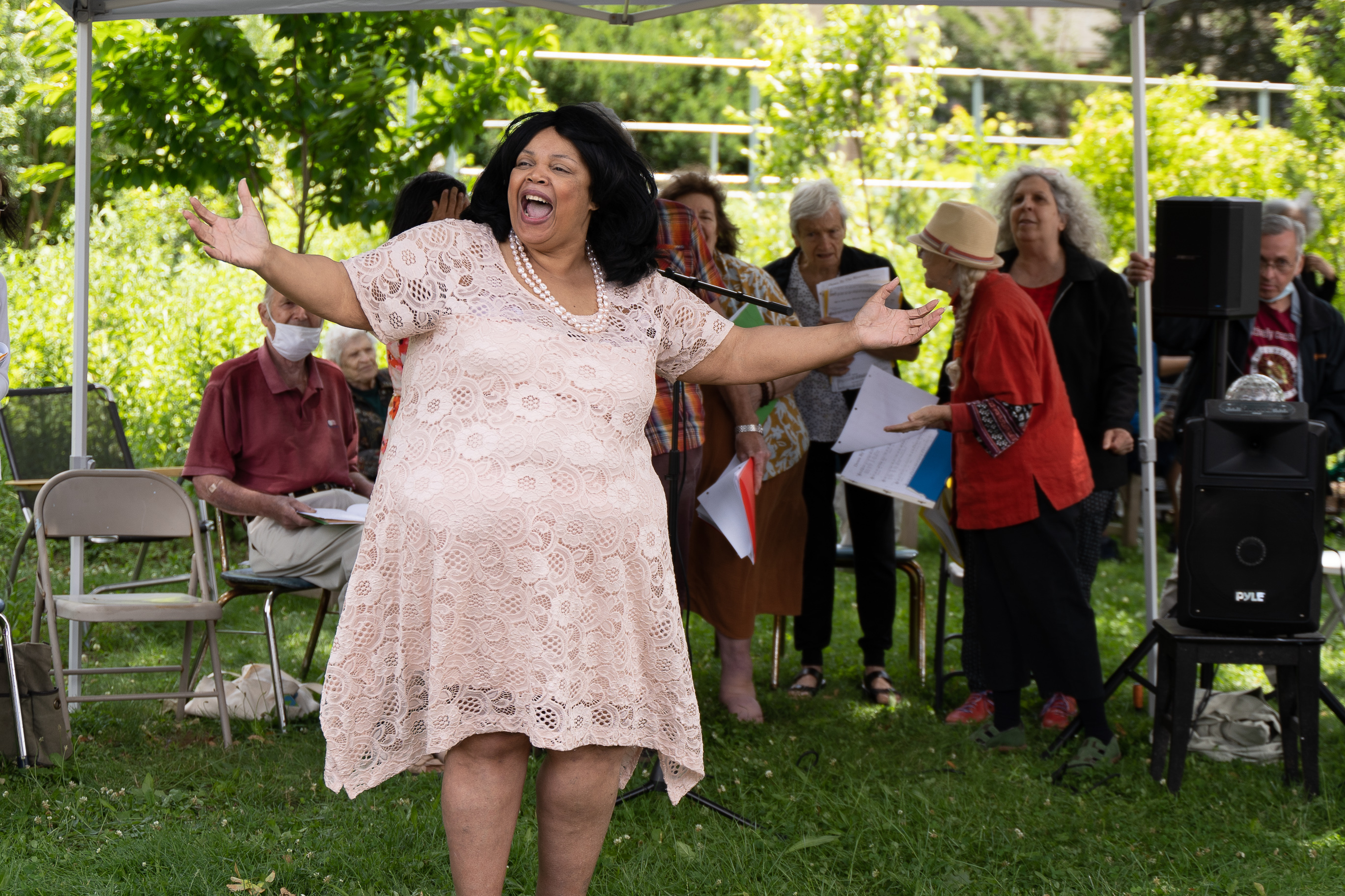 Cheryl Warfield from More Opera conducting and performing with JASA Chorus at JBOLC Garden Community Farmers Market grand opening and Juneteenth Holiday Celebration