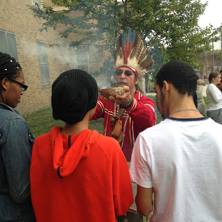 Roman Redhawk Perez leading the Snake Dance at the site of our new community garden